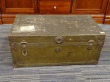 (R4) FOOT LOCKER; TRUNK HAS AN ANTIQUE BRASS FINISH, A PAPER LINED INTERIOR AND METAL BINDINGS.