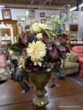 (R4) ARTIFICIAL FLOWER ARRANGEMENT; SITS IN A PAINTED VASE WITH A PURPLE, GREEN AND CREAM TONED