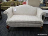 (R4) CLAYTON MARCUS LOVESEAT; ROLL ARM, CAMEL BACK LOVESEAT WITH A CREAM FLORAL UPHOLSTERY. SITS ON