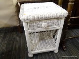 (R4) WICKER END TABLE; WHITE PAINTED WICKER SIDE TABLE WITH A SINGLE TOP DRAWER AND A LOWER SHELF.