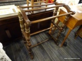 (R4) QUILT RACK; WOODEN QUILT RACK WITH TURNED POLE LEGS AND BRACKET FEET. 2 OF THE LEGS HAVE BEEN