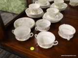 SET OF ROYAL WETTIN AUSTRIA TEACUPS, CONSOMME BOWLS, AND SAUCERS; SET OF 16 FLORAL PATTERNED