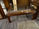 (R1) GLASS TOP COFFEE TABLE; WOODEN COFFEE TABLE WITH GLASS TABLE TOP. REEDED DETAILING ON THE SIDES