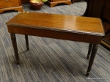 (R2) PIANO BENCH WITH STORAGE; WOODEN PIANO BENCH WITH SHERATON LEGS. HAS A FLIP TOP SEAT THAT