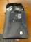 (R3) VINTAGE BLACK BAG; BAG WITH BUTTON LATCHING TOP FLAP AND A HANDLE. MAY HAVE BEEN USED FOR A