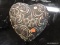 (R3) HEART DECORATION; POTTERY ART, HEART SHAPED DECORATION WITH FLORAL ACCENTS AND A BROWN PAINT