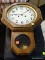 (R3) HANGING CLOCK; WOODEN, TRADITION CHIMING CLOCK. MEASURES 13.5 IN X 20 IN.