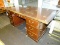 (WINDOW) EXECUTIVE DESK; CHERRY EXECUTIVE DESK WITH 2 LOWER FILE DRAWERS, A CENTER DRAWER AND 2