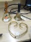 (R4) BRASS BELLS AND TRIVET; 3 PIECE LOT TO INCLUDE A HEART SHAPED, BRASS TRIVET AND 2 BRASS BELLS