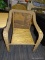 (R4.5) WICKER PATIO CHAIR; PATIO ARM CHAIR WITH FAUX WICKER ARMS AND A FAUX LEATHER LACED BACK.