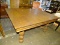 (R1) OAK DINING TABLE; TABLE COMES WITH A REED DETAILED SKIRT AND 4 VASE SHAPED, SHELL DETAILED LEGS