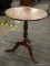 (R1) PEDESTAL SIDE TABLE; WOODEN SIDE TABLE WITH TURNED STEM, CIRCLE TOP, AND THREE SPLAYED CABRIOLE