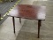 (R1) SIDE TABLE; WOODEN SIDE TABLE WITH TURNED LEGS. MEASURES 20 IN X 26 IN X 19.5 IN