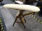 (R1) CONVERTIBLE IRONING BOARD CHAIR; WOODEN, FOLDING IRONING BOARD WITH CHAIR. HAS A CREAM PLAID