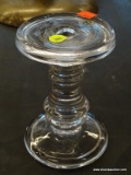 (R2) GLASS CANDLE STICK; HAS A DS STICKER ON IT. MEASURES 6.25 IN TALL.