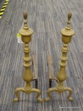 (R3) ANDIRONS; SET OF BRASS, VASE SHAPED FIREPLACE ANDIRONS. MEASURES 23.5 IN X 16 IN.