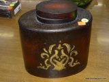 (R4) BOMBAY FLASK SHAPED JAR; HAS A FLORAL EMBOSSED AND PAINTED PATTERN ON THE FRONT. MEASURES 8.5