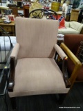 (R4.5) ARM CHAIR; PINK UPHOLSTERED ARM CHAIR WITH AN H STRETCHER. COMES WITH A PEACH THROW PILLOW.