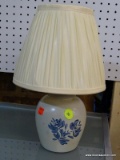 (WALL) TABLE LAMP; URN SHAPED CERAMIC TABLE LAMP, WHITE IN COLOR, WITH ABSTRACT LEAF AND FLOWER