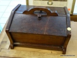 (R1) SEWING BOX; WOODEN TWO DOOR SEWING BOX WITH CARRYING HANDLE. INSIDE OF ONE LEG IS CHIPPED.