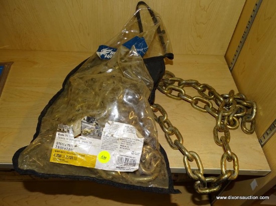 (R7) BLUE HAWK TRANSPORT CHAIN; HEAVY DUTY BRASS CHAIN, GRADE 70. 5/16 IN AND 25 FT LONG. COMES USED