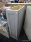 (R9) MASTERBRAND CABINET; TALL FLOOR CABINET, LIGHT GREY IN COLOR. HAS ONE DOOR THAT OPENS TO REVEAL