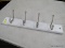 (R10) PANEL OF 4 HANGING HOOKS; WHITE RAIL WITH STAIN NICKEL GARMENT HOOKS. PRODUCT NO. 340462