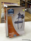 (R3) SECURE HOME MOTION ACTIVATED OUTDOOR WALL LIGHT WITH A BLACK FINISH AND CLEAR BEVELED GLASS.