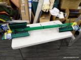 (R10) 4 PACK OF QUICKIE PUSH BROOMS; 18 IN QUICKIE BULLDOZER PUSH BROOMS, GREEN AND YELLOW IN COLOR.