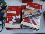 (R12) HOLIDAY LIVING CHRISTMAS LIGHTS AND HOLDERS; 2 PACKS OF 100 COUNT CHRISTMAS LIGHT HOLDERS.