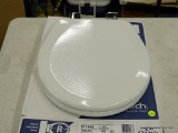 (R12) CHURCH TOILET SEAT; WOOD ROUND SLOW-CLOSE TOILET SEAT, WHITE IN COLOR. PRODUCT NO. 571468.