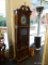 (WINDOW) GRANDFATHER CLOCK; DARK FINISHED WOODEN GRANDFATHER CLOCK WITH AN E. SCHMECKENBECHER DIAL