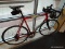 (WINDOW) ROAD BIKE AND BIKING SHOES; ULTRALIGHT BICYCLE WITH AN ALUMINUM CANNONDALE 6061 ALLOY FRAME