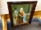 COLORED PRINT SHOWS MOTHER TERESA WITH A CHILD. SITS IN A MAHOGANY SHADOW BOX FRAME. MEASURES 22.5