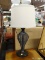 TABLE LAMP; MODERN BRONZE TABLE LAMP WITH BODY COMPRISING HORIZONTAL WIRE WRAPPED FRAME. TOP AND