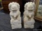 PAIR OF MARBLE FOO DOGS; ONE HAS CLAWS STANDING ON A BALL AND THE OTHER STANDING ON A CUB. HAS AN