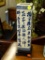 ANTIQUE BLUE AND WHITE SQUARE CYLINDER VASE ADORNED WITH CHINESE SCRIPTURE. MEASURES 12 IN TALL.