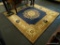 MOMENI ORIENTAL AREA RUG; MASISON AUBUSSON DESIGN AREA RUG WITH A BLUE COLOR. MEASURES 7 FT 9 IN X 7