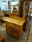 ANTIQUE OAK WASHSTAND; ANTIQUE BOW FRONT WASHSTAND WITH A TOWEL BAR, A TOP DRAWER AND A LOWER