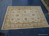 JEWEL AREA RUG; OUSHAK STYLE, MACHINE WOVEN, IVORY AREA RUG. MEASURES 5 FT X 8 FT.