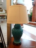 GINGER JAR STYLE TABLE LAMP; BLUE GLOSS FINISH TABLE LAMP WITH A WOVEN LIKE TEXTURE. SITS ON A