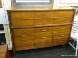 MID CENTURY MODERN DRESSER; WOODEN, 15-DRAWER DRESSER WITH 5 ROWS OF 3 DRAWERS. TOP 2 ROWS HAVE