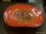 HAND BLOWN ART GLASS BOWL. HAS AN ORANGE TOP AND PURPLE BOTTOM. HAS A 22 IN DIAMETER.