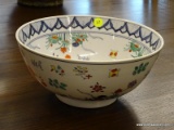 ORIENTAL HAND PAINTED RICE BOWL WITH AN ORANGE FISH IN THE CENTER.