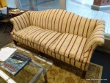 (WINDOW) CAMELBACK SOFA; THREE CUSHION SOFA WITH ROLLING ARMS. HAS INTRICATE FLORAL, SCROLL AND LEAF
