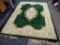 ORIENTAL AREA RUG; GREEN, YELLOW, AND CREAM ORIENTAL AREA RUG WITH YELLOW, BLUE AND RED FLOWERS. HAS