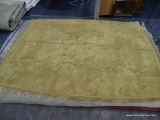 ROUNDED CORNER AREA RUG; MUSTARD YELLOW, MACHINE WOVEN AREA RUG WITH FRINGS ALL AROUND THE RUG.