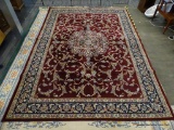 IMPERIAL AREA RUG; HEIRLOOM FLORAL PATTERNED AREA RUG WITH A WINE AND NAVY COLOR. MEASURES 7 FT 8 IN