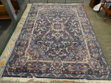 DALYN RUG COMPANY AREA RUG; CLASSICAL LEAVES AREA RUG WITH A NAVY COLOR. HAS FLORAL AND LEAF