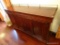 (DR) VINTAGE MAHOGANY SIDEBOARD; BRASS GALLERY ON TOP, INLAID DETAILING AROUND THE TOP, ROUNDED